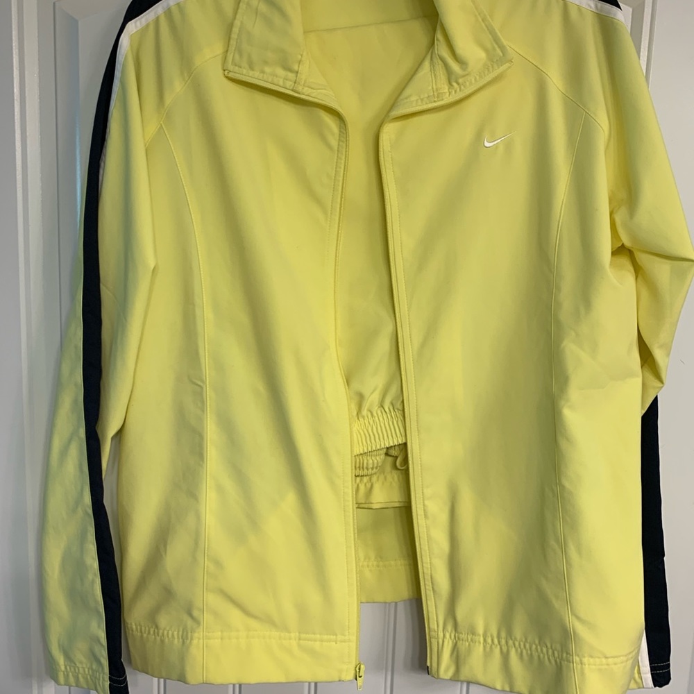 Nike 2 pc track suit. Yellow and navy XL jacket and pants. Pants are crop length